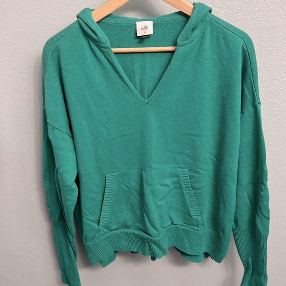 Just in time for St.Patrick’s Day! Super cute CAbi green sweater. Worn one time!
